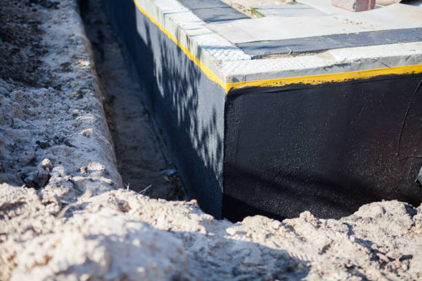 Professional Waterproofing technician working in Holbrook, NY